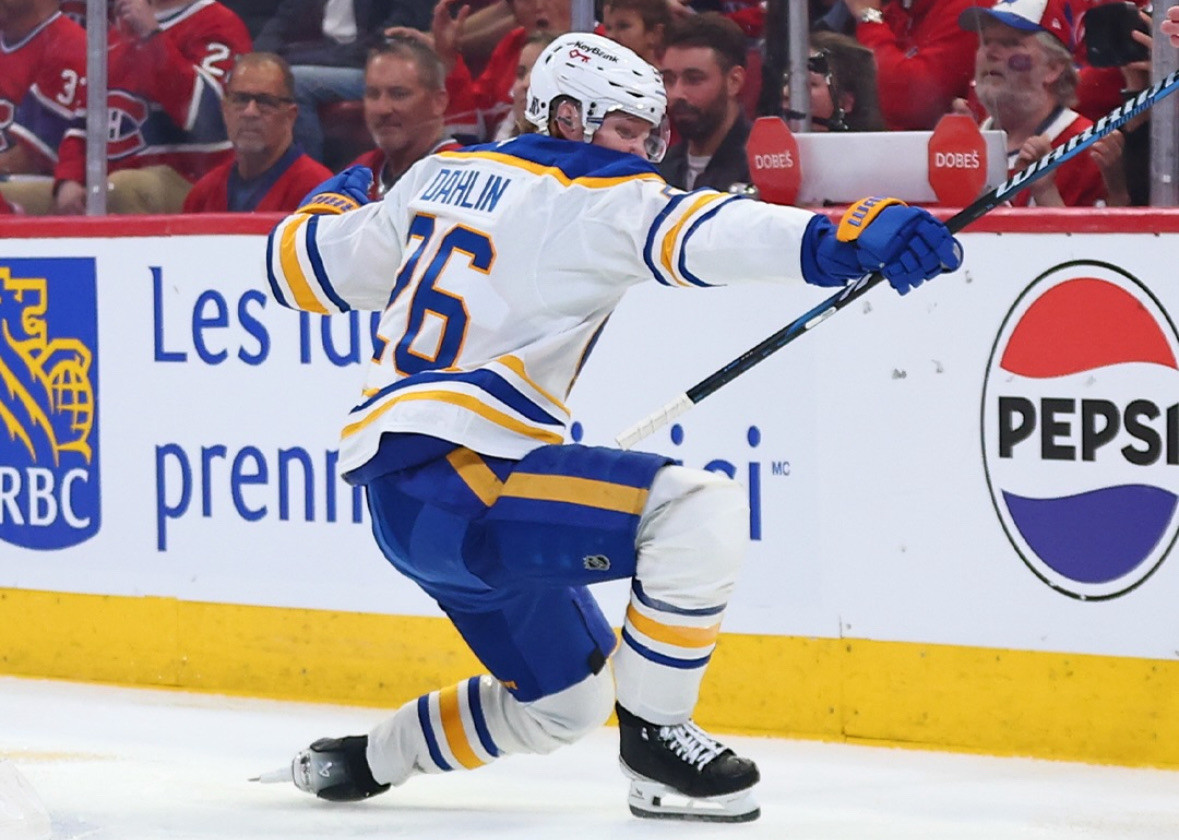 Buffalo Sabres captain Rasmus Dahlin slides on one knee and celebrates a goal during Game 6 of the Stanley Cup Playoffs against the Montreal Canadiens.