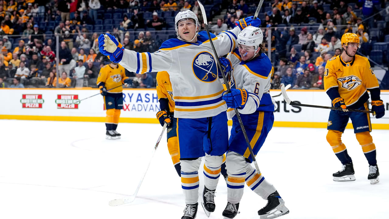 Buffalo Sabres forward Konsta Helenius celebrates his first NHL goal with teammate Zach Benson against the Nashville Predators.